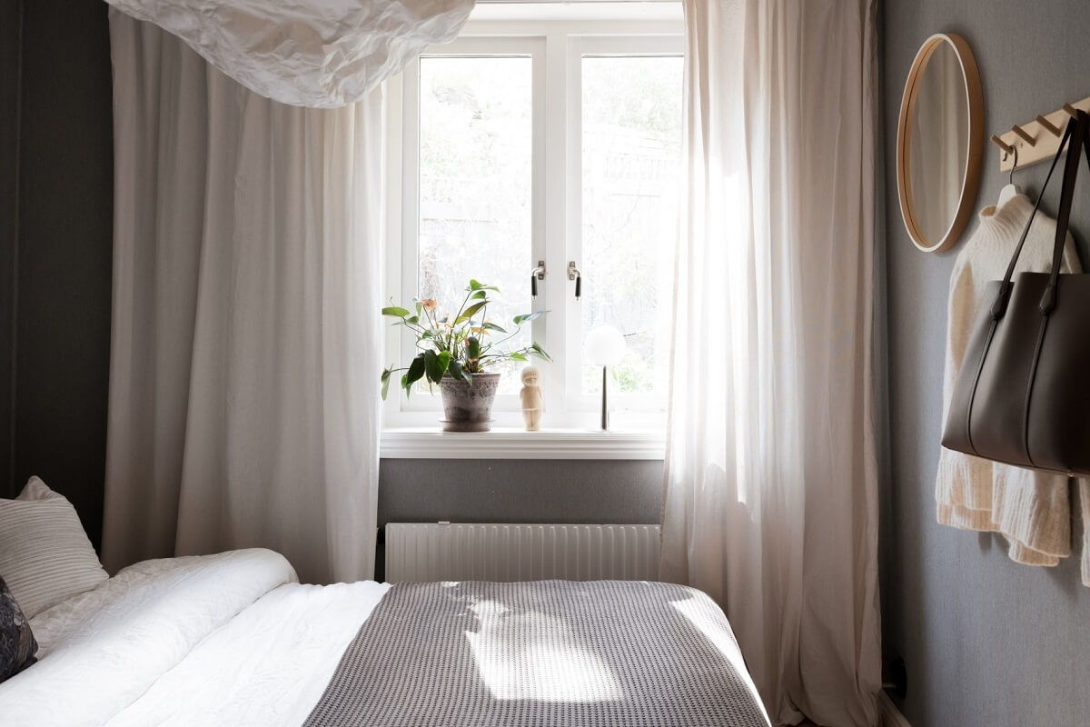 A Pink Swedish House with a Lovely Garden 14 gray bedroom