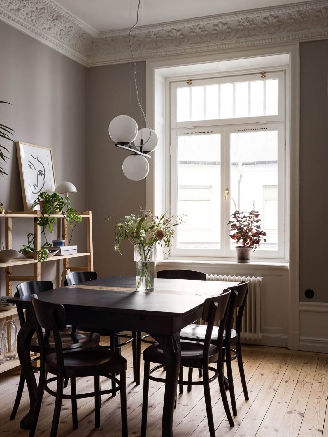 A Gray Stockholm Apartment with a Black Kitchen 9 gray dining room