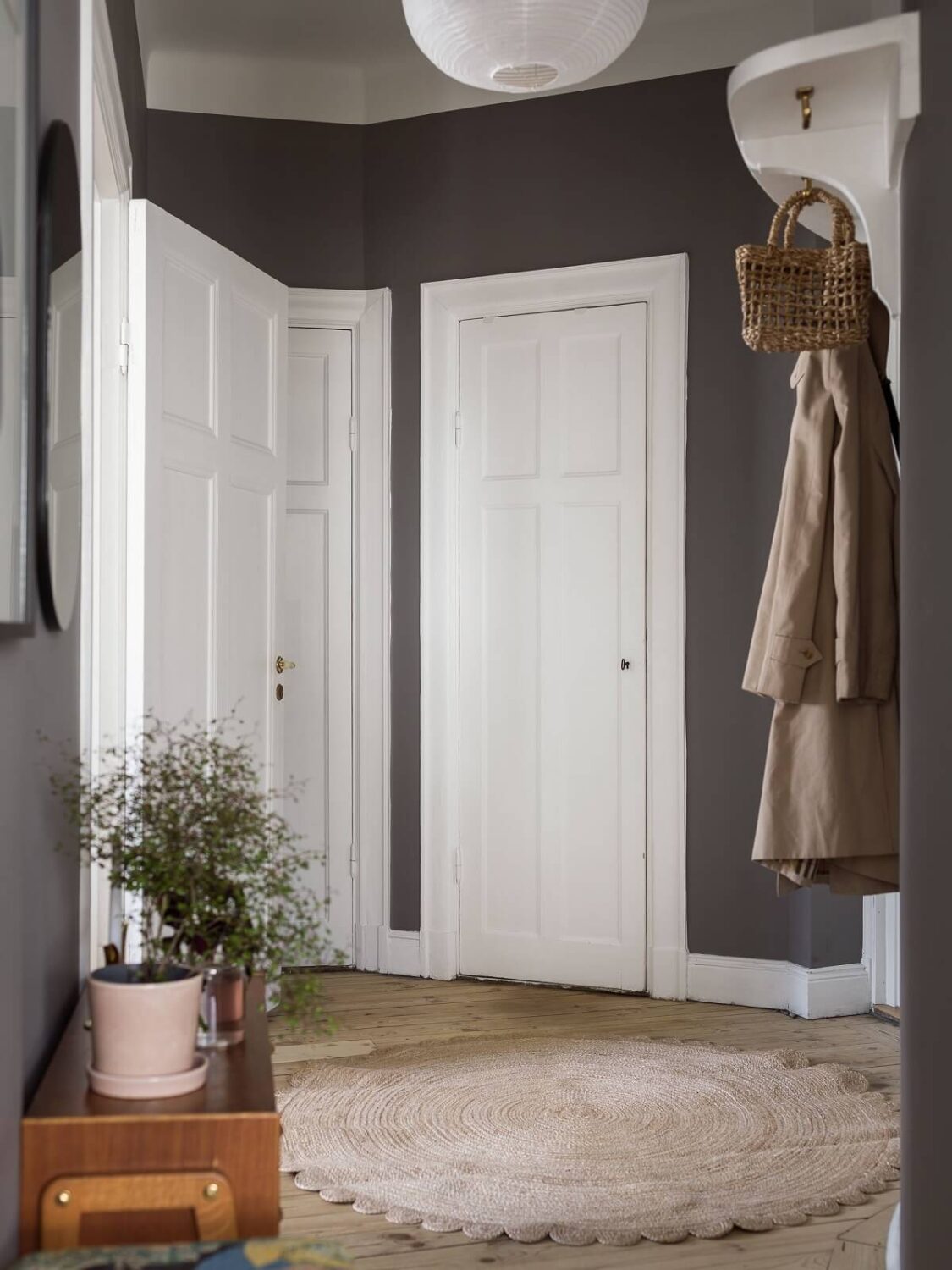 A Gray Stockholm Apartment with a Black Kitchen 20 gray hallway