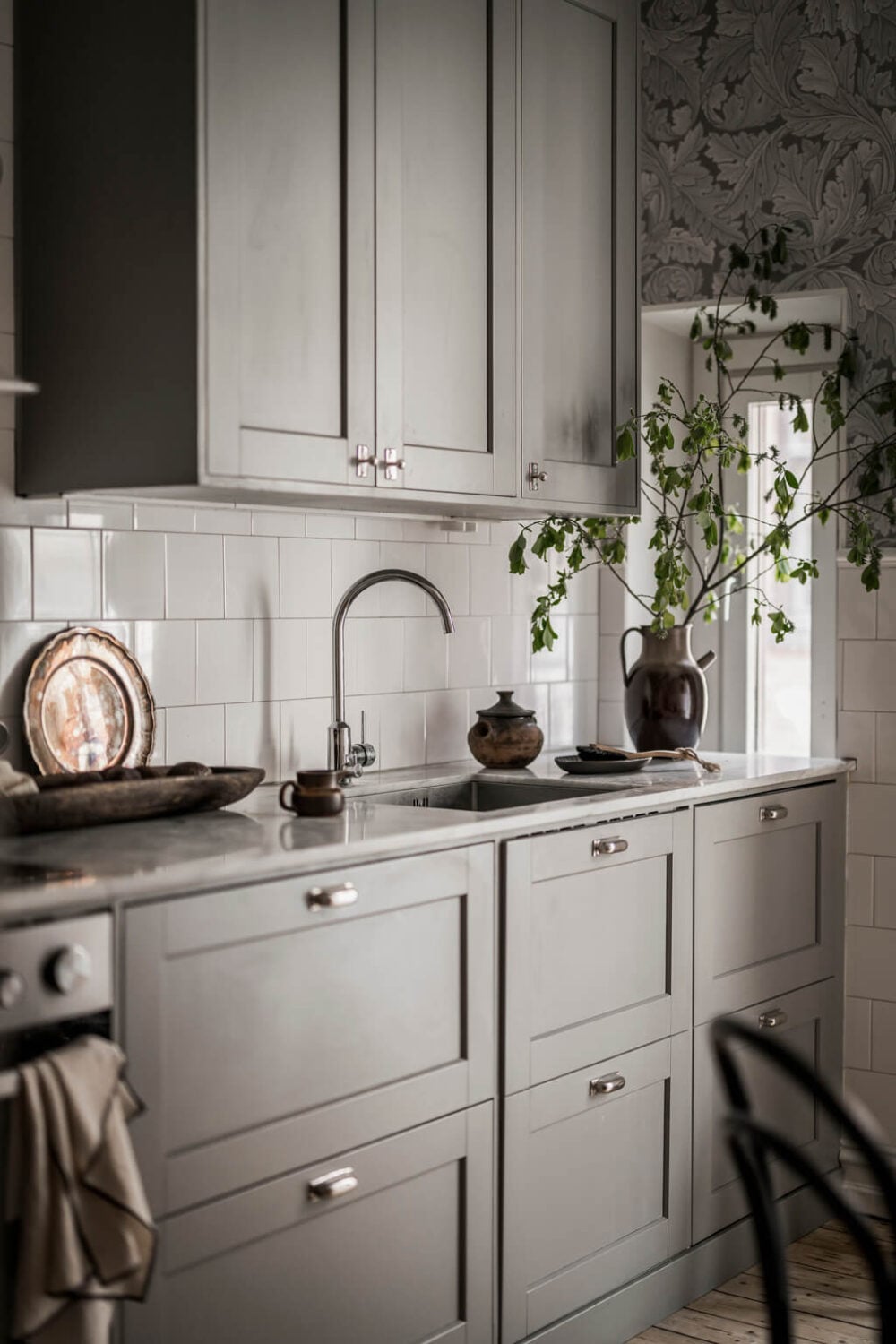 Wallpaper and Historic Charm in a Swedish Apartment 14 gray kitchen cabinets