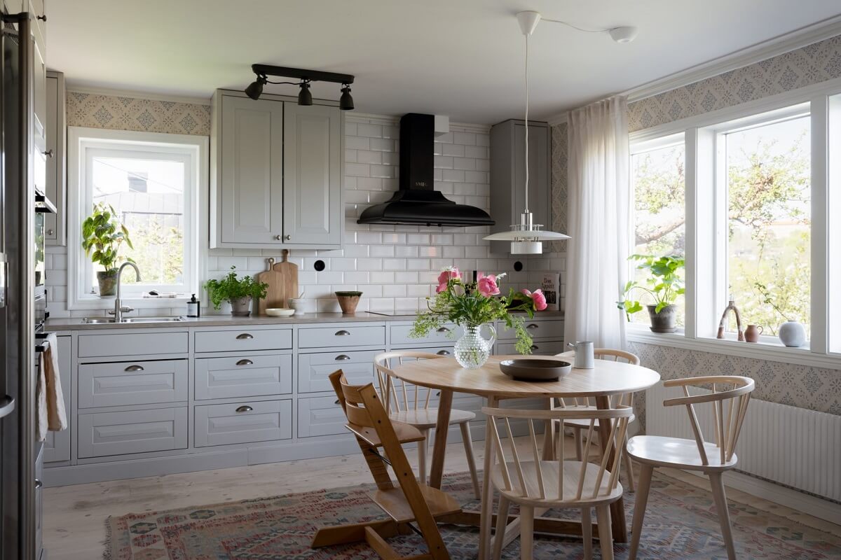A Pink Swedish House with a Lovely Garden 8 gray kitchen with round table