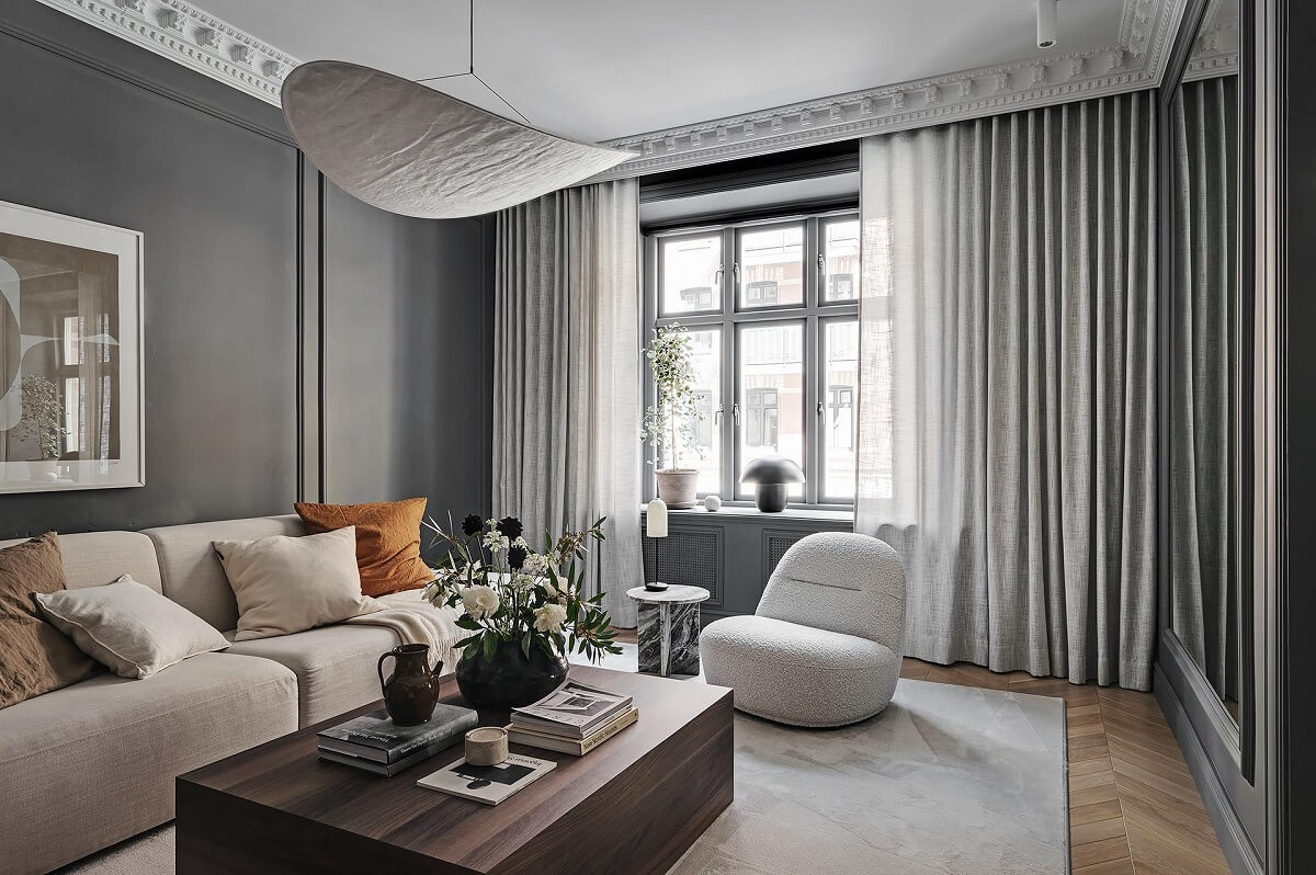 A Luxurious Renovated Apartment with Dark Gray Walls 5 gray living room ceiling ornaments