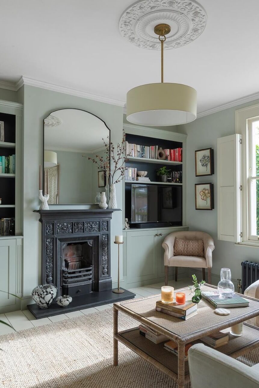 A Victorian House with a Blue deVOL Kitchen 9 gray living room with fireplace and large mirror
