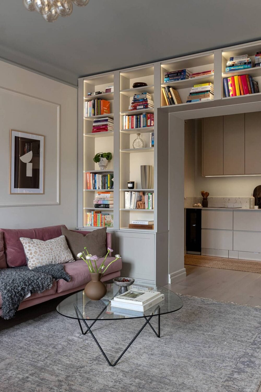 gray living room with lighted built in bookshelves