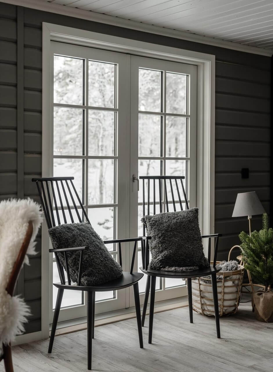 A Gray Swedish Log House Decorated for Christmas 8 gray painted log house