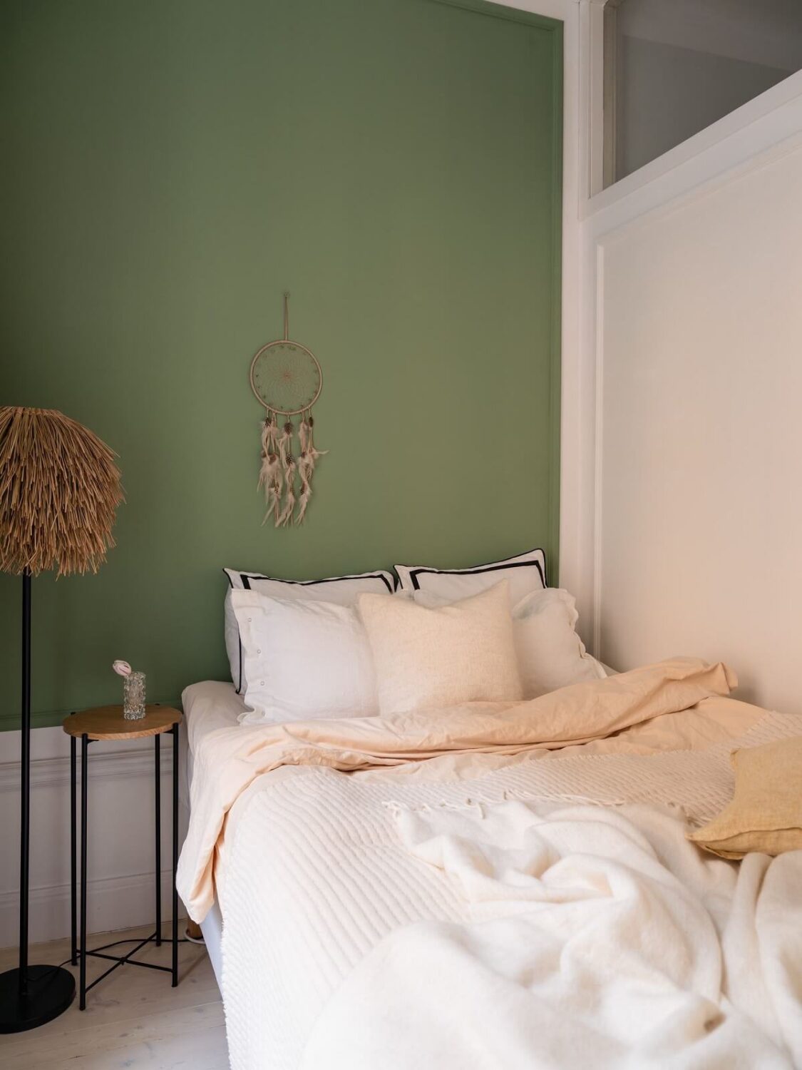 A Small, Tastefully Renovated Apartment in Stockholm 14 green accent wall tiny bedroom