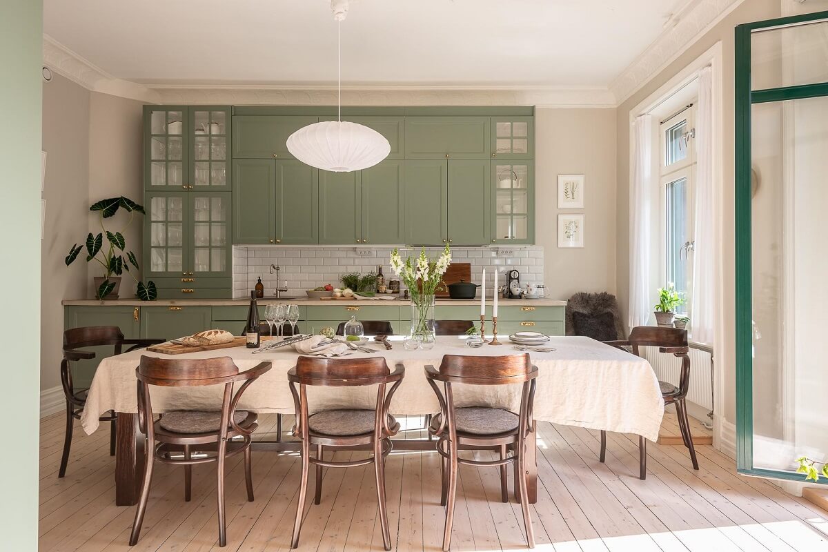 A Turn of the Century Apartment with a Green Kitchen 8 green cupboards