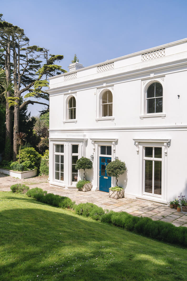 Grand Rooms and Vibrant Colors in an English Country Home 25 green front door white home Grand Rooms and Vibrant Colors in an English Country Home