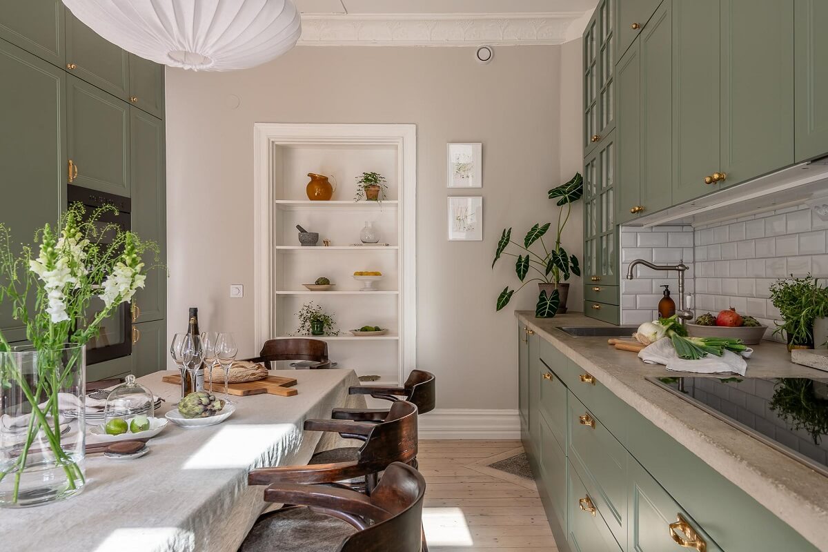 A Turn of the Century Apartment with a Green Kitchen 9 green kitchen cabinets