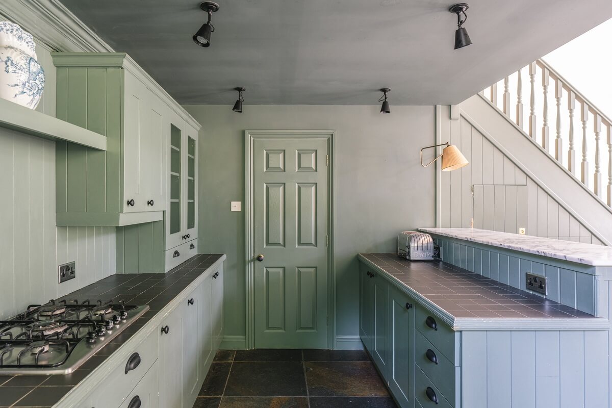 Grand Rooms and Vibrant Colors in an English Country Home 8 green smoke kitchen cabinets nordroom