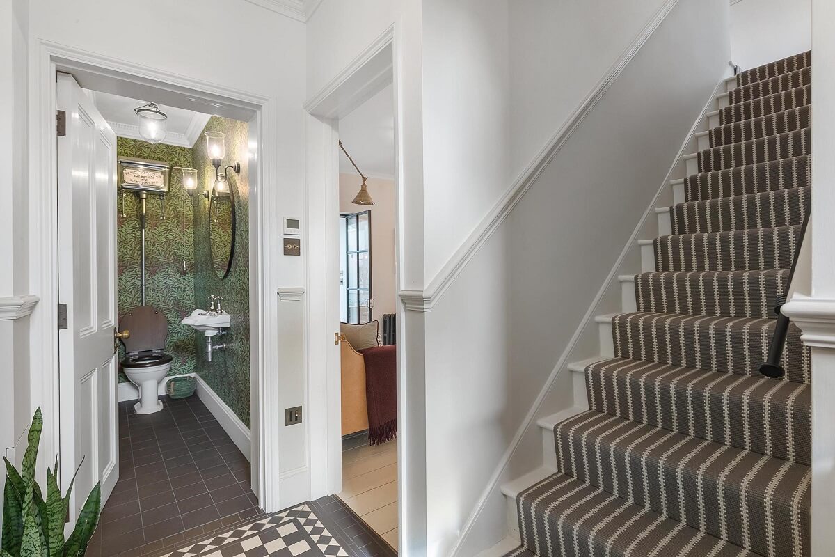 A Victorian House with a Blue deVOL Kitchen 11 hall with stairs and powder room