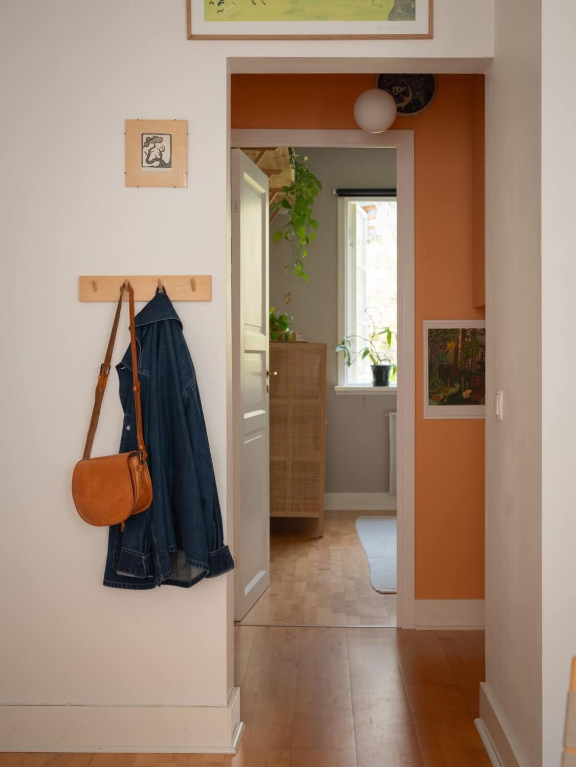 Warm Orange Tones in a Small Apartment 9 hallway orange wall