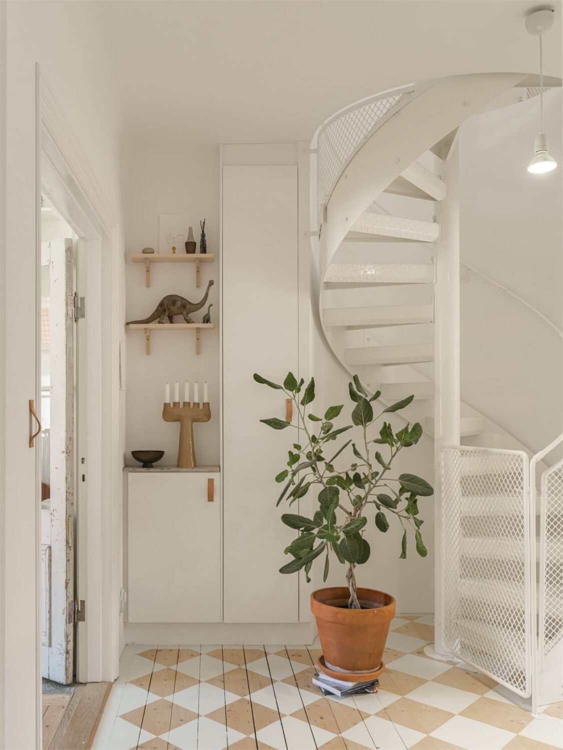 Wooden Details in a Light Duplex Apartment in Sweden 15 hallway with checkerboard floor