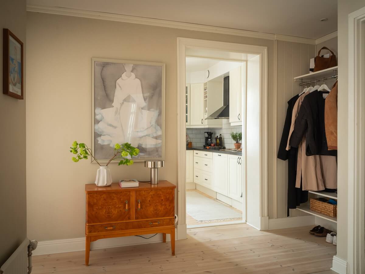 Original Details in a Light-Filled Swedish Apartment 16 hallway-with-coat-storage-and-vintage-cabinet