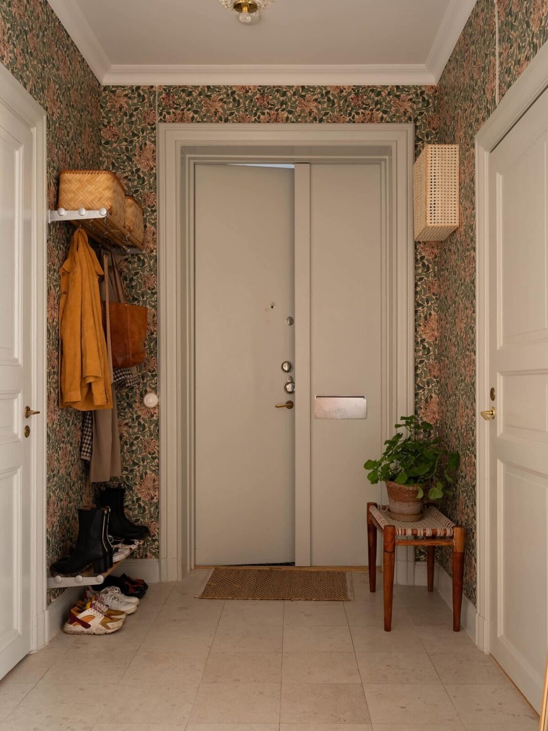 Light and Dark Tones in a Stunning Apartment 30 hallway with wallpaper