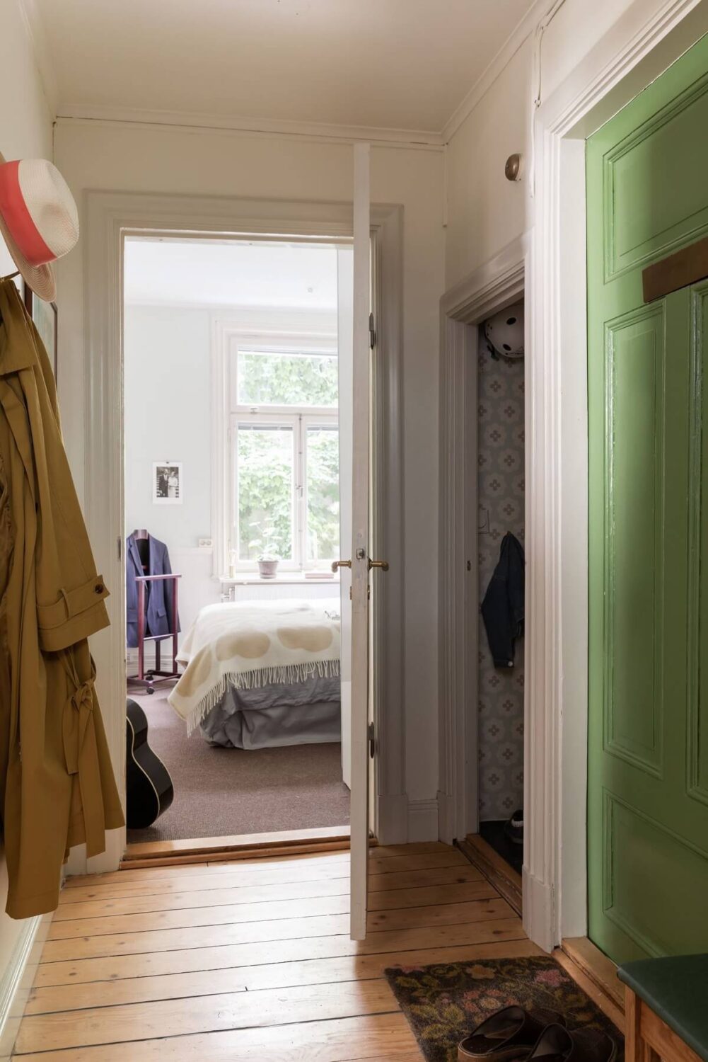 A Swedish Duplex with a Unique Wood and Pastel Colored Kitchen 14 hallway with wooden floor