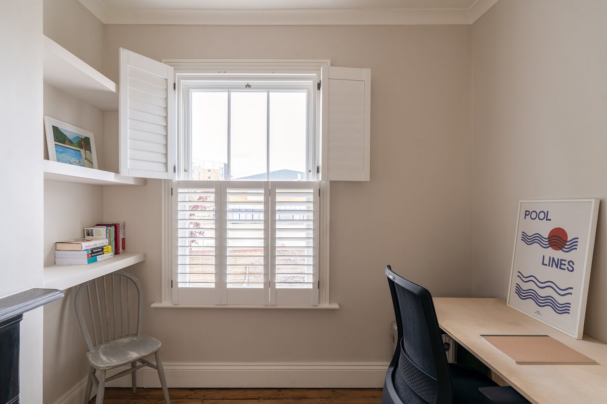 A Tiny Maisonette with Original Details in London 10 home office with window shutters