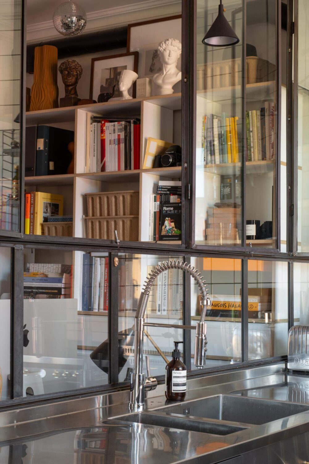 A Corner Apartment with an Industrial Style Kitchen 4 industrial glass wall
