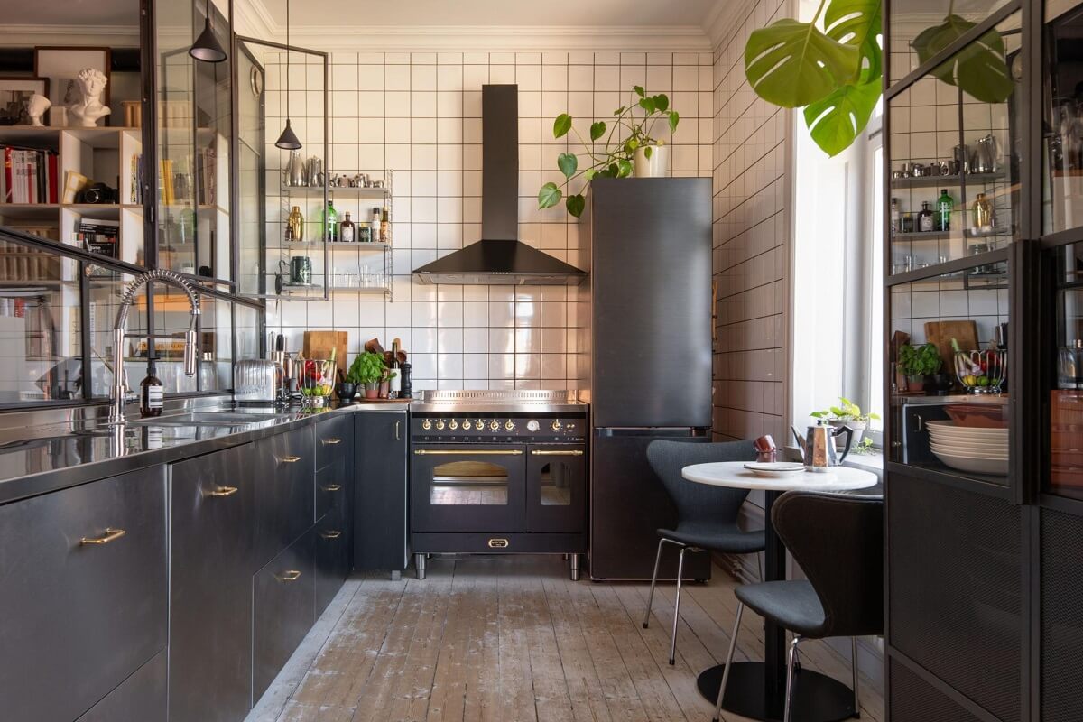 A Corner Apartment with an Industrial Style Kitchen 1 industrial kitchen with white tiles and inner window nordroom