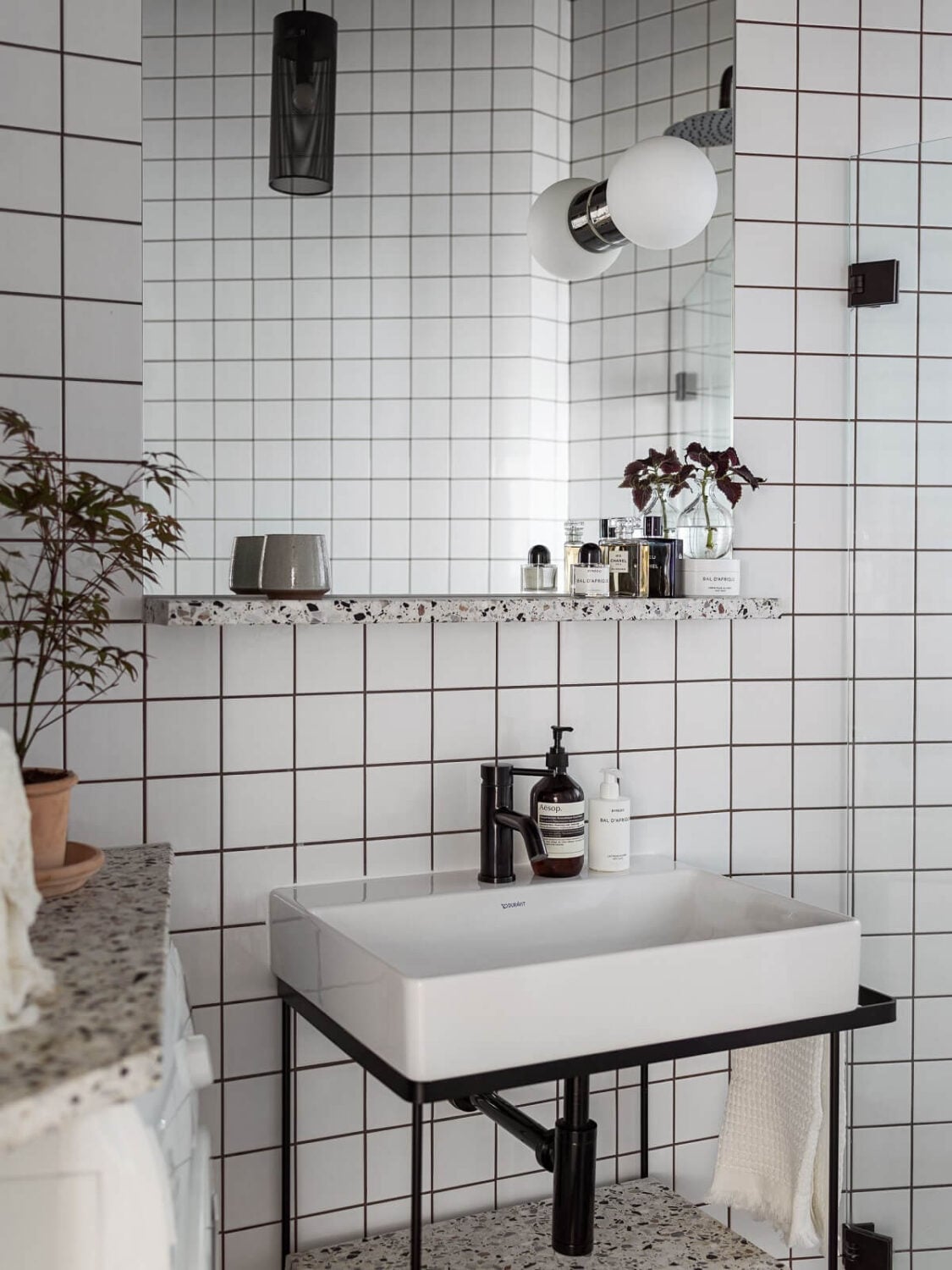 A Gray Stockholm Apartment with a Black Kitchen 17 industrial style bathroom with white tiles and black fittings nordroom