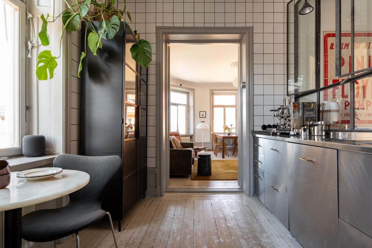 A Corner Apartment with an Industrial Style Kitchen 5 industrial style kitchen with white tiles