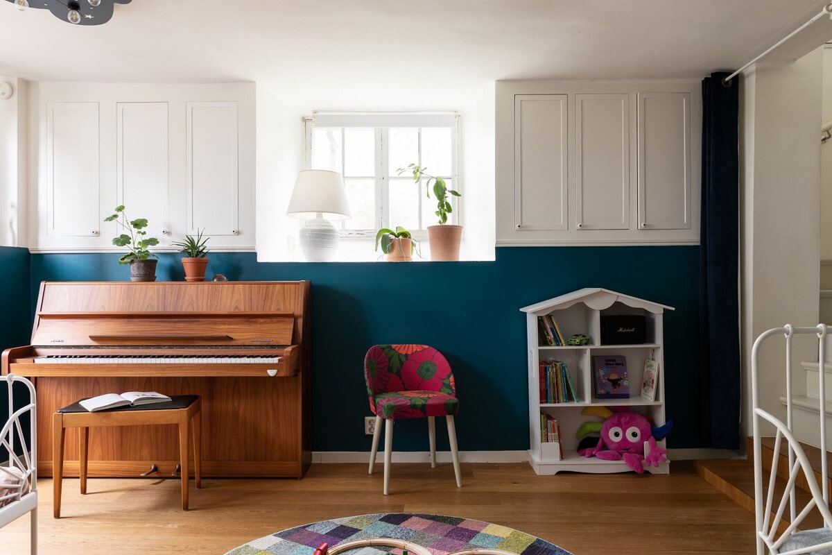 A Swedish Duplex with a Unique Wood and Pastel Colored Kitchen 22 kids bedroom with half painted teal wall nordroom