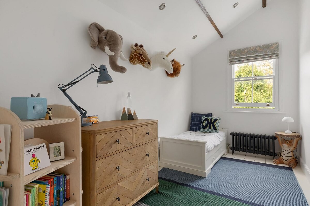 A Victorian House with a Blue deVOL Kitchen 20 kids bedroom with slanted ceiling