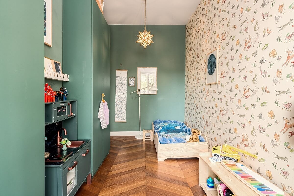 A Colorful Family Home with Open-Plan Spaces in Amsterdam 21 kids bedroom with wallpaper and green wall
