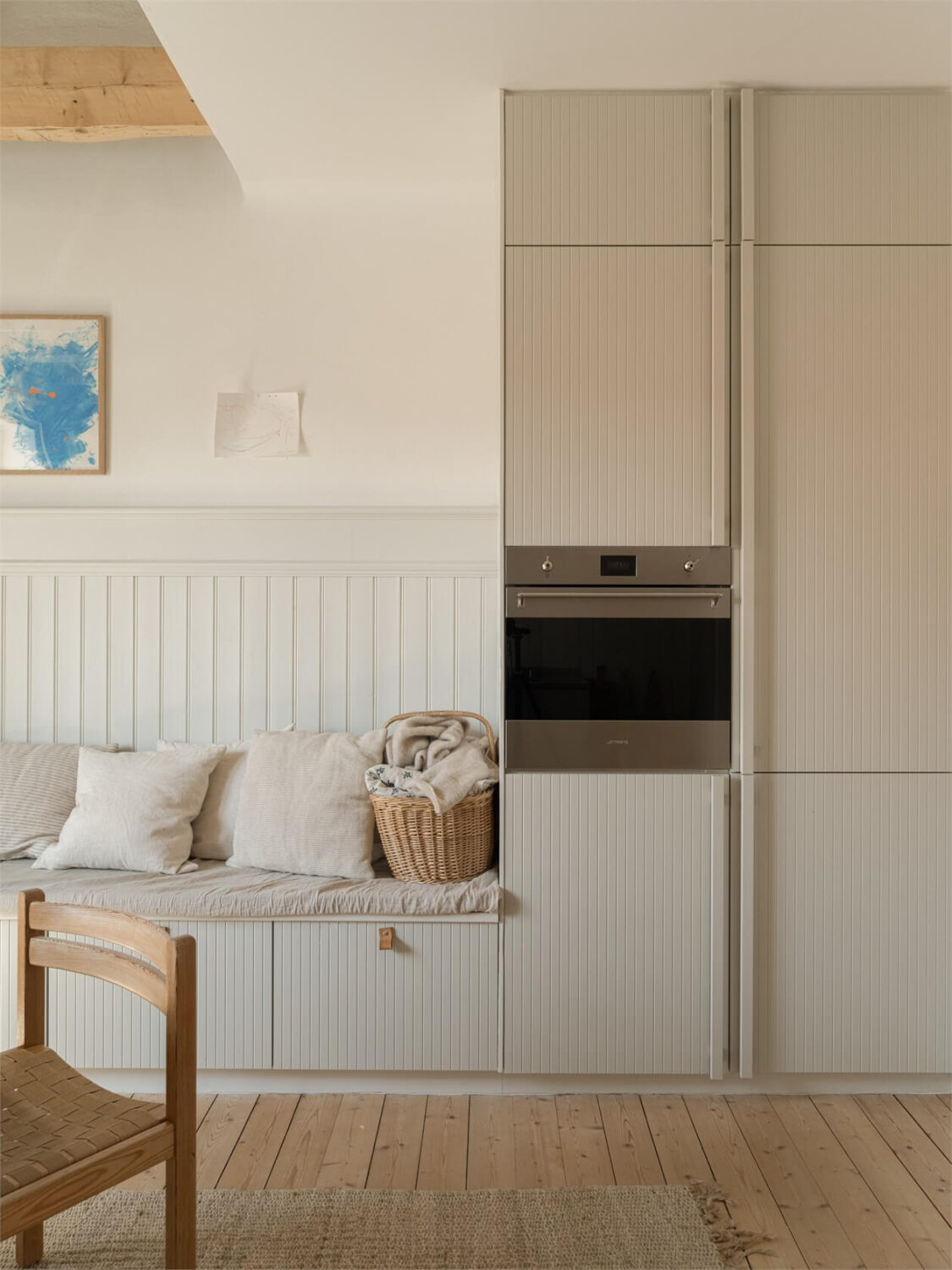 Wooden Details in a Light Duplex Apartment in Sweden 12 kitchen cabinets and storage bench