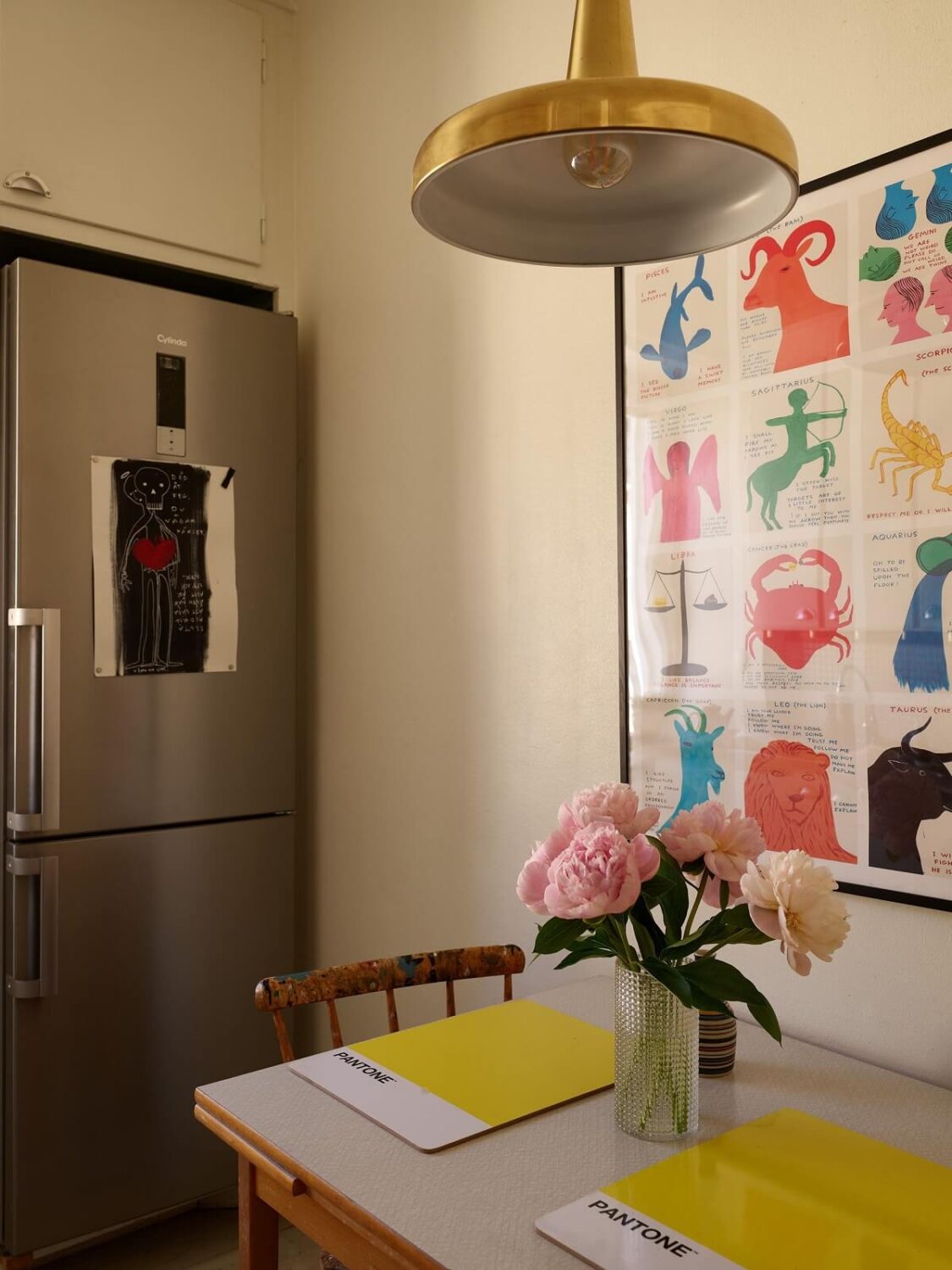 A Vintage Apartment with a Vibrant Blue Bedroom 10 kitchen table with yellow pendant