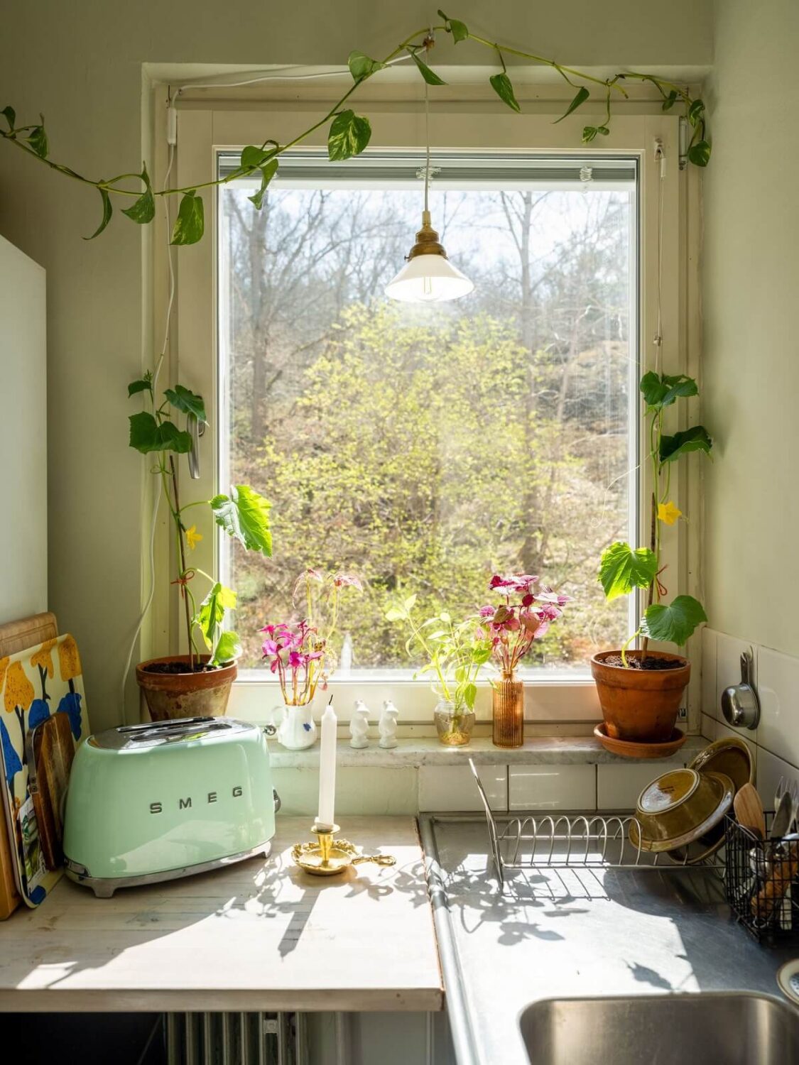 A Studio Apartment with Vintage Green Cabinets 13 kitchen view