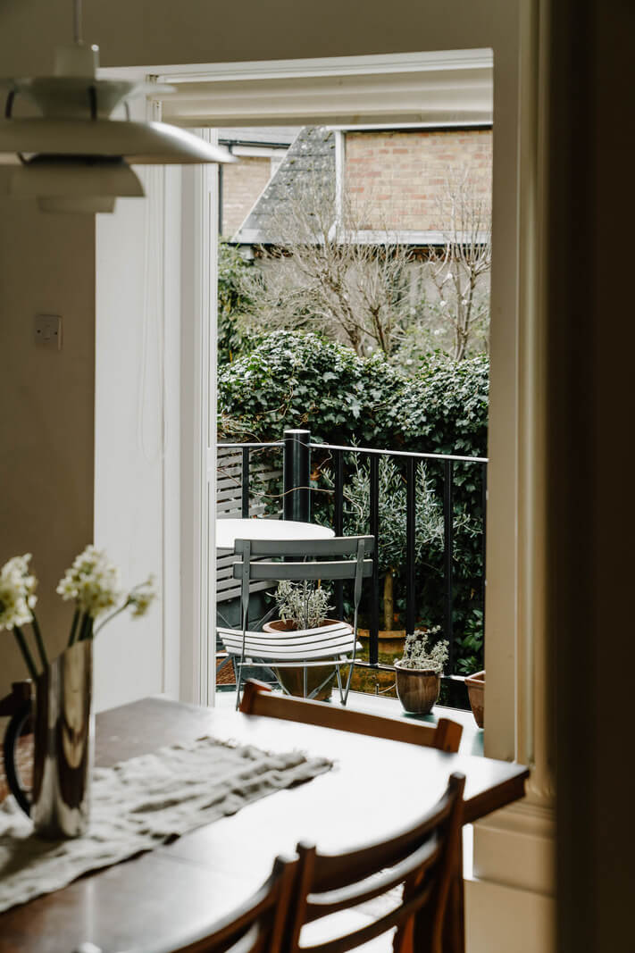 Neutral Tones and Original Features in an English Townhouse 5 kitchen view into courtyard garden