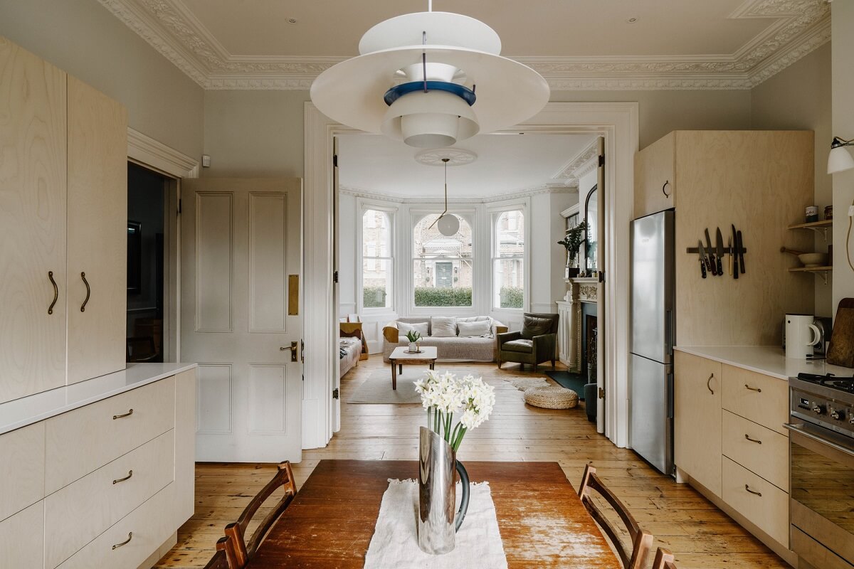 Neutral Tones and Original Features in an English Townhouse 4 kitchen view into living room