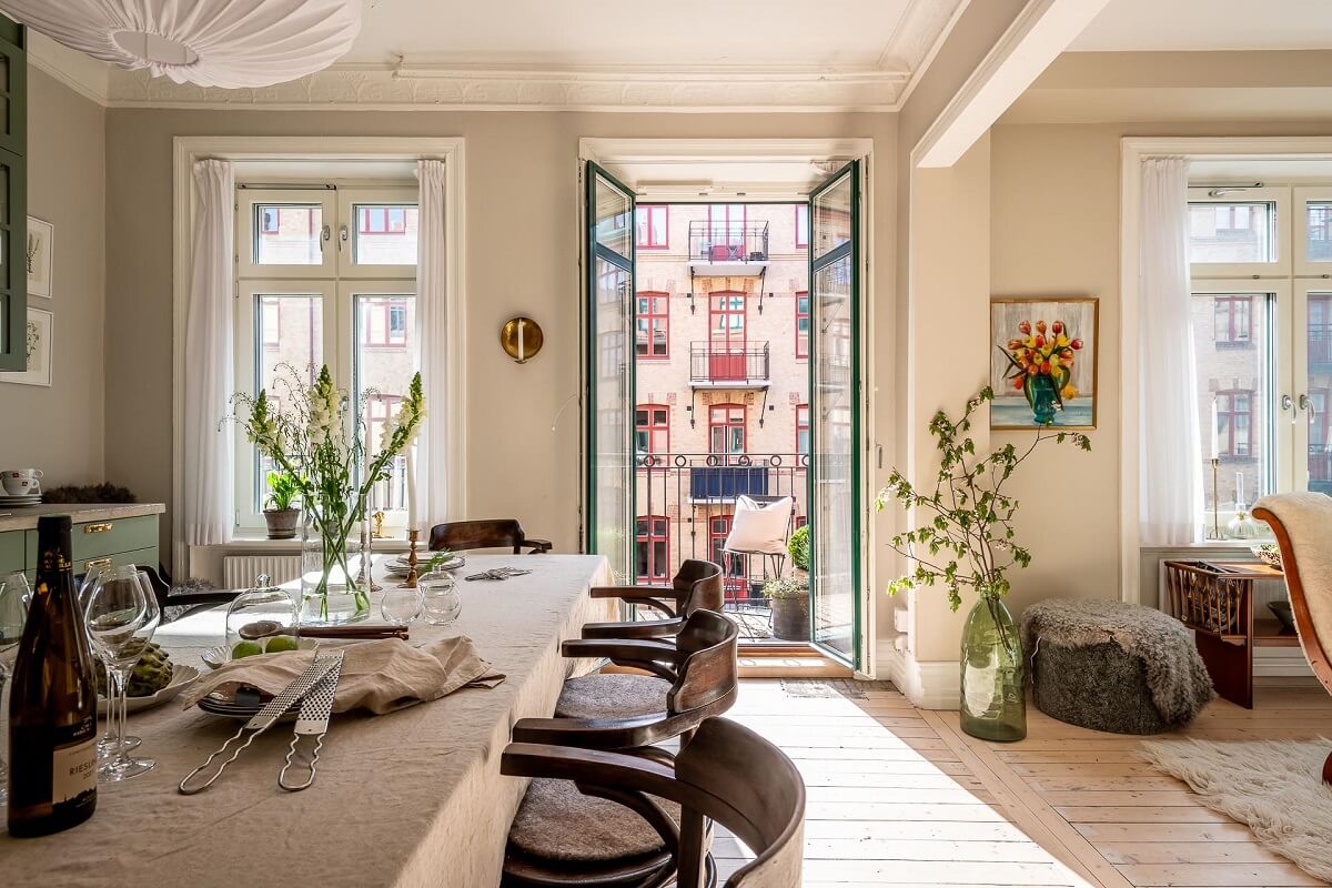 A Turn of the Century Apartment with a Green Kitchen 12 kitchen with access to balcony