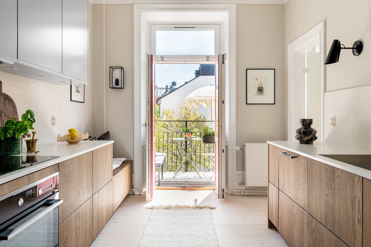 A Light Renovated Apartment in Stockholm 8 kitchen with balcony access