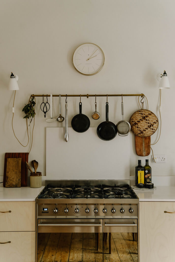 Neutral Tones and Original Features in an English Townhouse 3 kitchen with brass rails