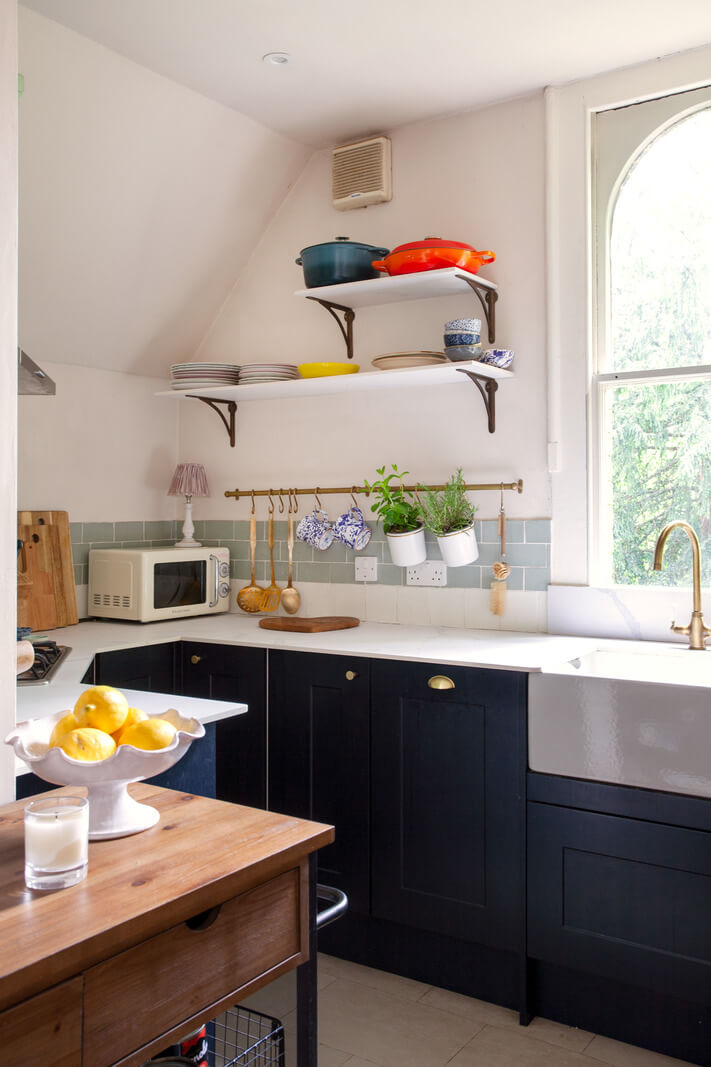 Charming Cottage Style in a London Maisonette 7 kitchen with butler sink arche window and shelves nordroom