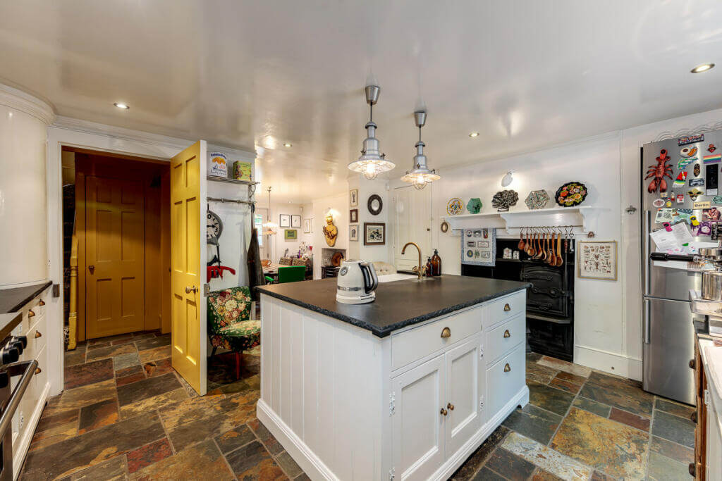 Unique Color Combinations and Design in a London Townhouse 10 kitchen with flagstone floor