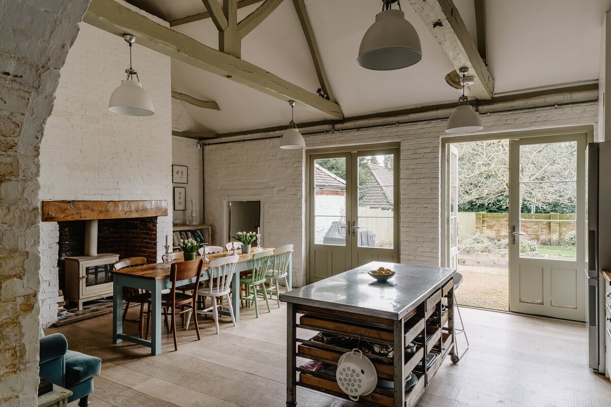 An 18th-Century Historic House with an Amazing Kitchen 2 kitchen with pitched ceiling exposed beams and fireplace nordroom