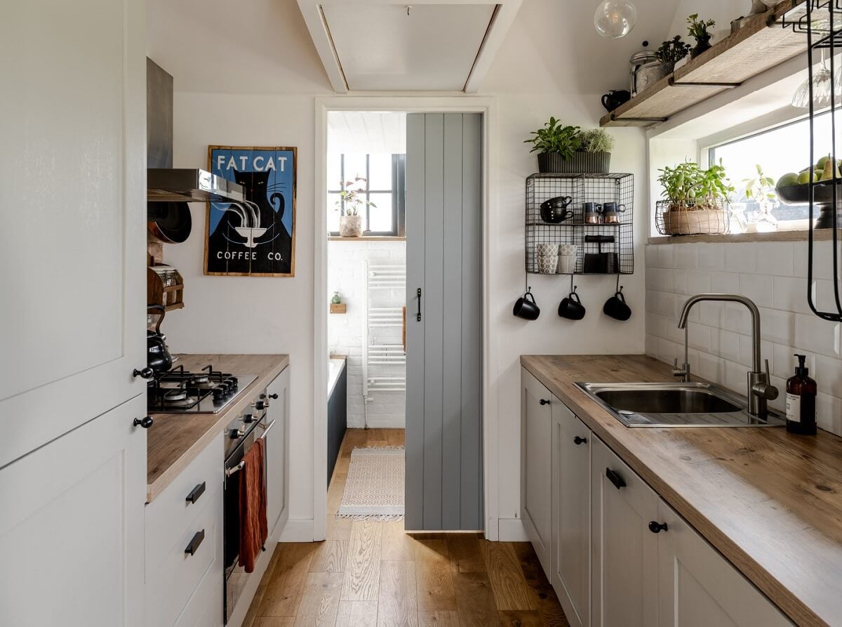 A Tiny Off-Grid House in the English Countryside 6 kitchen-with-sliding-door-to-bathroom-nordroom