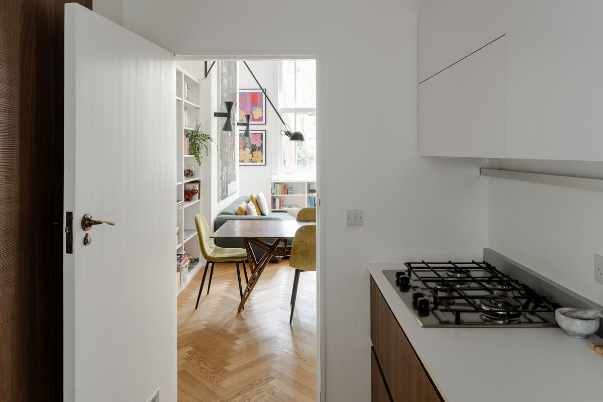 High Ceilings in a Light London Apartment 8 kitchen with walnut and white cabinets nordroom