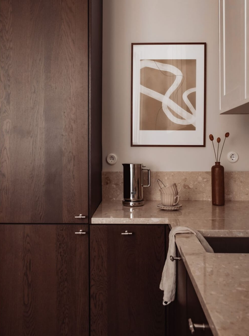 A Serene and Luxurious Apartment in Stockholm 10 kitchen with walnut cabinets