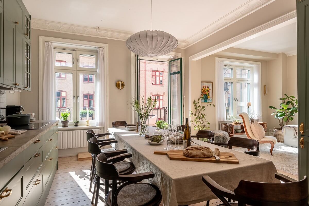 A Turn of the Century Apartment with a Green Kitchen 13 large dining table in kitchen