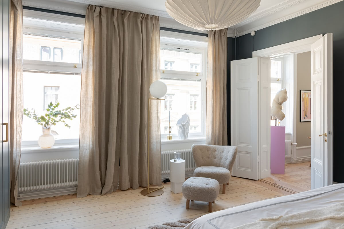 A Light Renovated Apartment in Stockholm 14 large gray bedroom with wooden floor