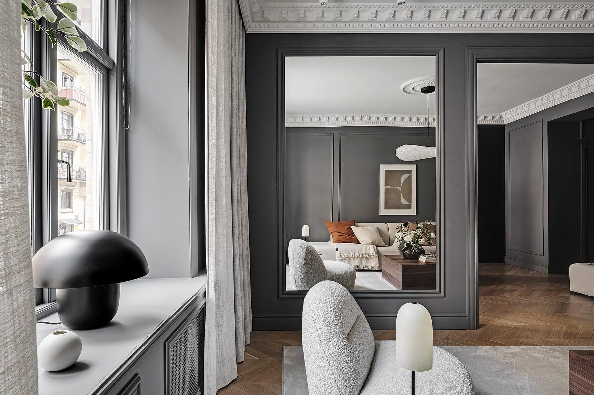 A Luxurious Renovated Apartment with Dark Gray Walls 4 large mirror in gray living room