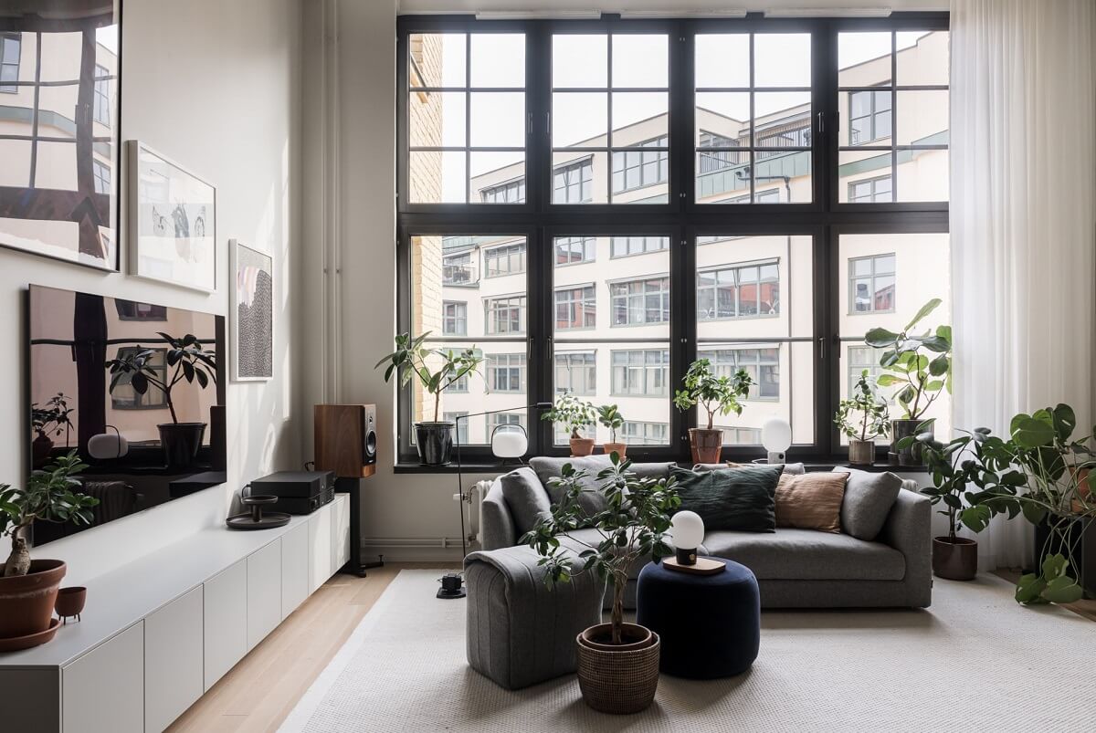 A Monochrome Loft with High Ceilings and Art 5 large window in monochrome loft living room
