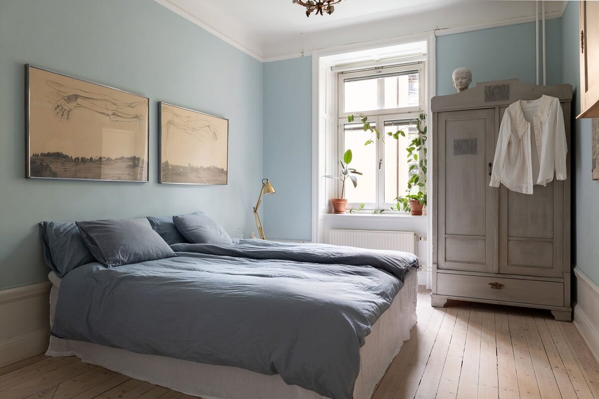 A Swedish Apartment with a Yellow Kitchen 16 light blue bedroom
