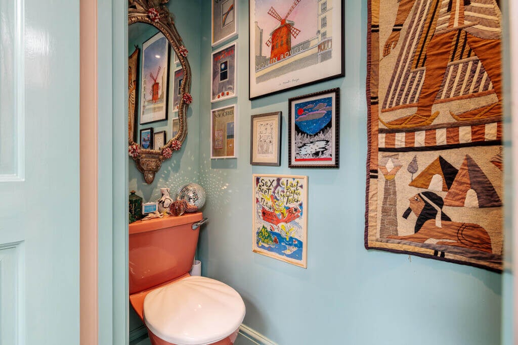 Unique Color Combinations and Design in a London Townhouse 15 light blue powder room with art