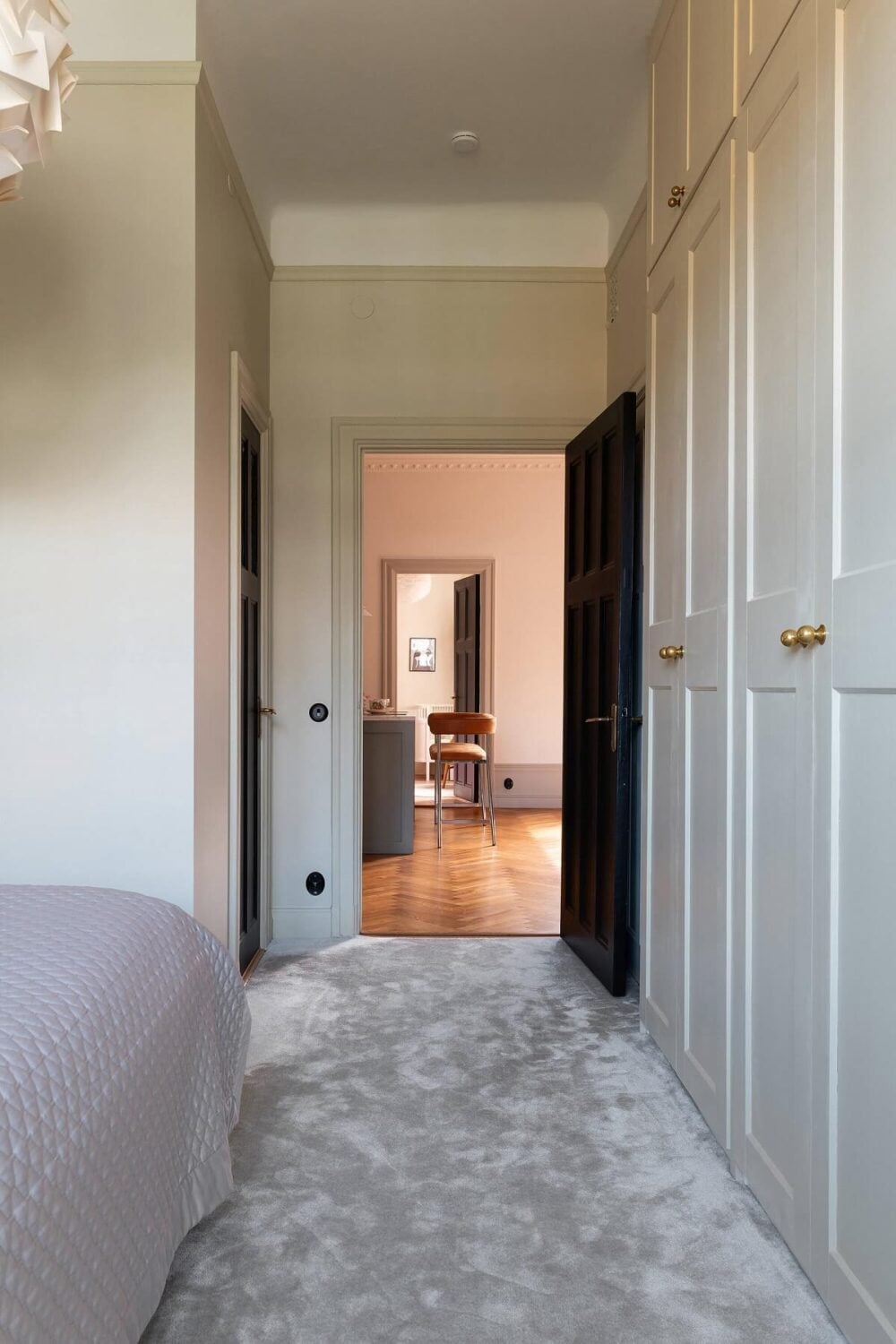 An Elegant Turn-of-the-Century Apartment in Stockholm 27 light gray bedroom carpet and floor to ceiling wardrobes nordroom