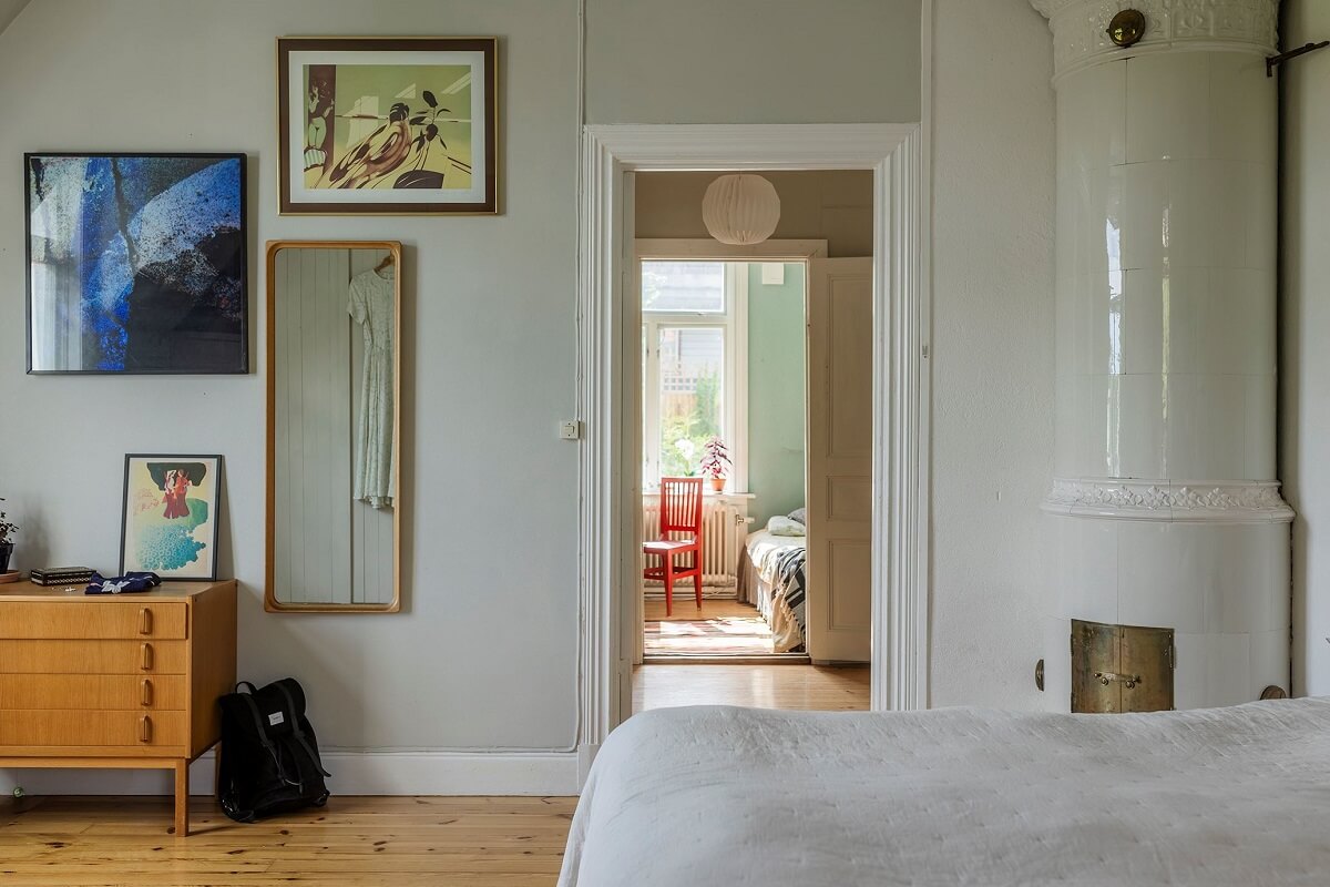 A Historic Swedish Country House with a Beautiful Garden 16 light gray bedroom with fireplace